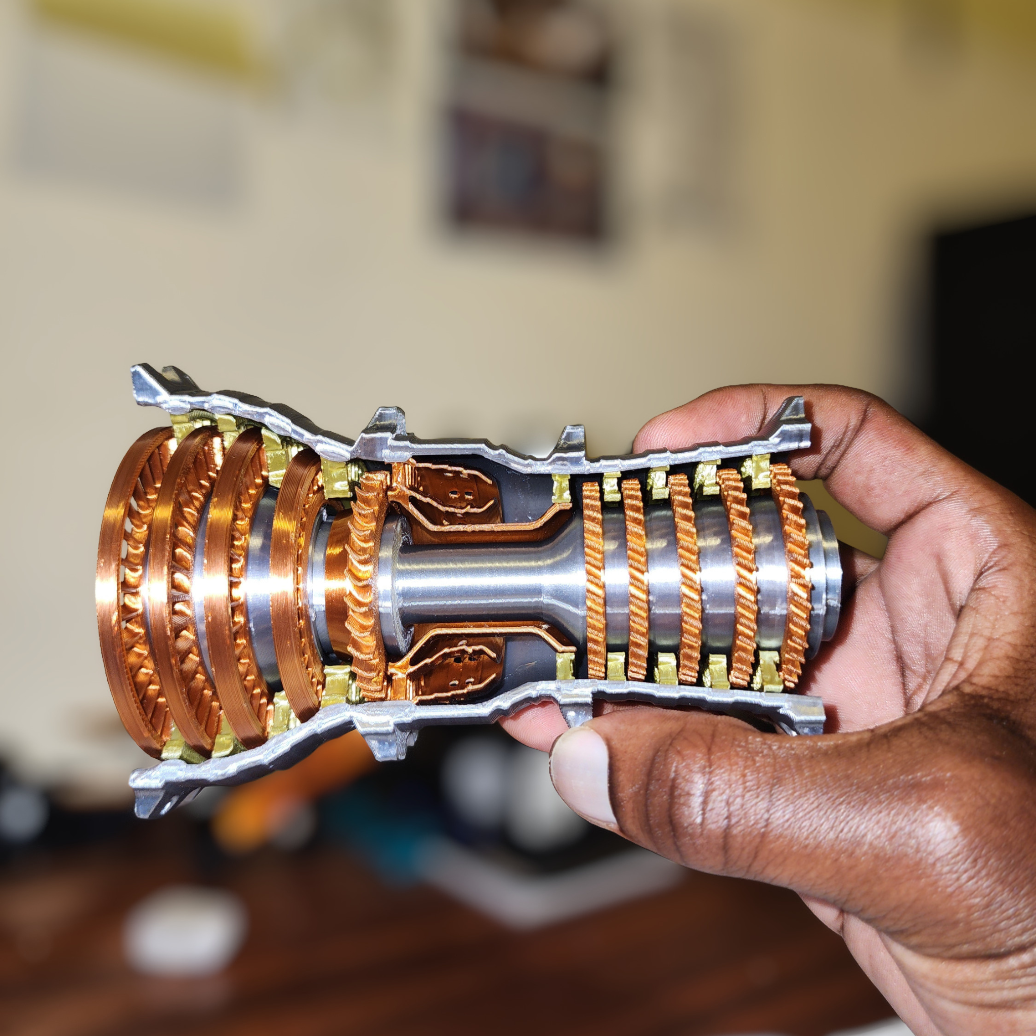 Hand holding Trent 900 turbofan engine cutaway model showing compressor and turbine stages