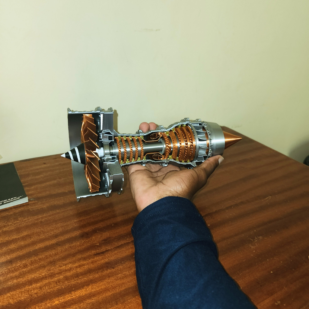 Hand holding assembled Trent 900 turbofan engine model with detailed internal components